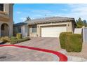 Single-story home with attached garage and landscaped yard at 3532 Labrusca Vines Ct, North Las Vegas, NV 89081