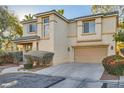 Two-story home with two car garage, tile roof, tidy landscaping and desert-friendly xeriscaping at 2731 Heathrow St, Las Vegas, NV 89135