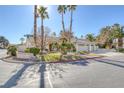 Beautiful home with a three-car garage and lush landscaping at 3767 Darren Thornton Way, Las Vegas, NV 89120