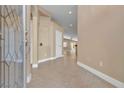 Welcoming entryway with decorative glass door, neutral tones, and tile flooring flowing into the home at 11605 Cabo Del Sol Ct, Las Vegas, NV 89138