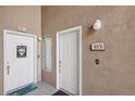 Building entrance with two doors and a welcoming sign at 8737 Red Brook Dr # 103, Las Vegas, NV 89128