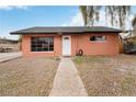 Charming single-story home with large windows, a front yard with gravel, and a walkway to the front door at 1925 Franklin Ave, Las Vegas, NV 89104