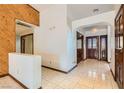 Bright entryway with tile floors and wood-paneled wall at 3189 Lipton Ct, Las Vegas, NV 89121