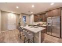 Modern kitchen with island, stainless steel appliances, and white countertops at 11712 Emerald Lake Ave, Las Vegas, NV 89138