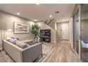 Spacious living room featuring hardwood floors and modern furniture at 11712 Emerald Lake Ave, Las Vegas, NV 89138