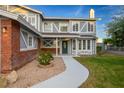 Charming home with a well-manicured lawn, beautiful landscaping, and an inviting walkway to the front door at 3531 W Arby Ave, Las Vegas, NV 89118