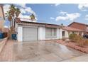 Front view of house showcasing a garage and driveway at 6724 Reggie Cir, Las Vegas, NV 89107