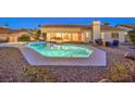 Expansive backyard pool with patio and seating area at 1052 Hollyhock Dr, Henderson, NV 89011