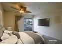 This spacious bedroom features a ceiling fan and sliding glass doors at 3550 Bay Sands Dr # 2044, Laughlin, NV 89029