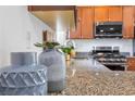 Granite kitchen counter with decorative bowls at 5266 Sherwood Forest Ln, Las Vegas, NV 89122