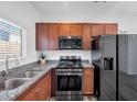 Modern kitchen with stainless steel appliances and granite countertops at 5266 Sherwood Forest Ln, Las Vegas, NV 89122