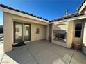 Charming courtyard with a fireplace and glass doors for seamless indoor-outdoor living at 2710 Mustang Pass St, Laughlin, NV 89029