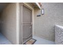 Home's front door featuring a metal security screen and the unit number 3030 above at 4200 S Valley View Blvd # 3030, Las Vegas, NV 89103