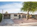 Ranch style home with carport and mature tree at 1208 Clairemont St, Las Vegas, NV 89110