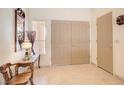 Inviting entryway with tiled floors and a classic wooden table and chair set at 3013 Sungold Dr, Las Vegas, NV 89134