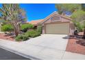 Charming single-story home featuring a well-manicured lawn and a two-car garage at 3013 Sungold Dr, Las Vegas, NV 89134