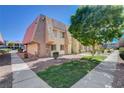 Exterior of building with desert landscaping, mature trees, and stone accents at 5301 River Glen Dr # 210, Las Vegas, NV 89103