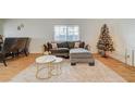 Living room features a gray sectional sofa, coffee table, and hardwood floors at 1420 Vegas Valley Dr # 18, Las Vegas, NV 89169