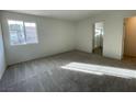 Cozy bedroom with natural light and plush gray carpeting at 2723 Luzzi Walk, Henderson, NV 89044