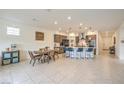 Open-concept living space with a well-appointed kitchen, dining area, and access to the backyard at 617 Sylvan St, Henderson, NV 89002