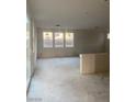 Bright open-concept living room featuring neutral walls and a large sliding glass door to allow for natural light at 6574 Tumoulin St, Las Vegas, NV 89148