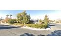 Street view of a single-story home with mature landscaping at 1552 Dorothy Ave, Las Vegas, NV 89119