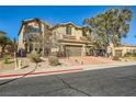 Two-story house with brick driveway and landscaping at 373 Via Sonador, Henderson, NV 89012