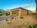View of exterior with desert landscaping, driveway, and well-maintained facade at 4036 Shetland Pony St, Las Vegas, NV 89122