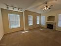 Spacious living room with fireplace and neutral carpet at 10550 W Alexander Rd # 2149, Las Vegas, NV 89129