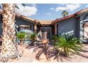 Elegant entryway with ornate doors, fountain, and lush landscaping at 440 Probst, Las Vegas, NV 89110