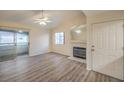 Living room with fireplace, sliding door and laminate flooring at 2725 S Nellis Blvd # 2096, Las Vegas, NV 89121