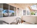 Small patio with seating, outside of unit entrance at 7944 Diamond Rock Way # 202, Las Vegas, NV 89128