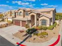 Two-story home with a landscaped yard and attached garage at 8824 Prague Ct, Las Vegas, NV 89147