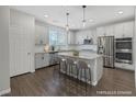 Modern kitchen featuring stainless steel appliances and an island at 356 Espressivo St, Henderson, NV 89011