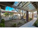 Covered patio area with brick columns and walkway to gate at 3012 Plaza De Rosa, Las Vegas, NV 89102