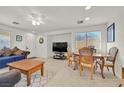 Combined living and dining area with a table and chairs at 6058 Ambleshire Ave, Las Vegas, NV 89139