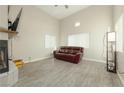 Living room with fireplace, hardwood floors, and couch at 1904 Las Palmas Ln # 203, Laughlin, NV 89029