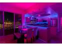 Kitchen with island and city views at night at 150 Las Vegas Blvd # 814, Las Vegas, NV 89101