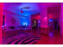 Living room with zebra print rug and colorful lighting at 150 Las Vegas Blvd # 814, Las Vegas, NV 89101