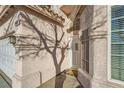 Front door entrance with a tree shadow and welcome mat at 3456 Beca Faith Dr, North Las Vegas, NV 89032