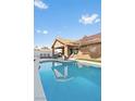 Inviting backyard pool offers a refreshing escape with serene surroundings and ample space at 175 Enloe St, Henderson, NV 89074