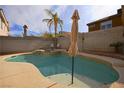 Enjoy this inviting kidney shaped pool with patio seating at 8737 Autumn Valley Ave, Las Vegas, NV 89129