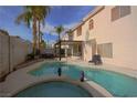 Relaxing pool and spa with patio furniture and a pergola at 8737 Autumn Valley Ave, Las Vegas, NV 89129