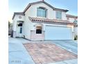 Two-story house with a two-car garage and landscaped front yard at 3667 Spring Willow Ct, Las Vegas, NV 89147