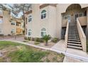View of condo building with stairs leading to the second floor apartment at 3145 E Flamingo Rd # 1045, Las Vegas, NV 89121