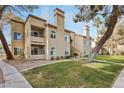 Charming two-story exterior showing the building's architecture and manicured landscaping at 3145 E Flamingo Rd # 1045, Las Vegas, NV 89121