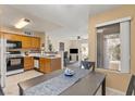 Open floor plan with dining area flowing into the kitchen and living space at 3425 E Russell Rd # 240, Las Vegas, NV 89120