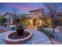 Landscaped entry with brick pavers at 62 Golf Estates Dr, Las Vegas, NV 89141