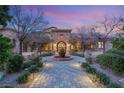 Stone house with courtyard and fountain at 62 Golf Estates Dr, Las Vegas, NV 89141