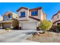 Two-story house with a beige exterior and a two-car garage at 4788 Frankfurt Ct, Las Vegas, NV 89147